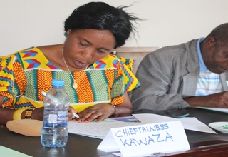 Chieftainess Kawaza (L) and Senior Chief Kalindawalo signing the meeting resolutions