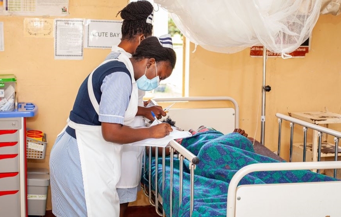 A midwife at Kabwe General Hospital conducting routine monitoring of maternal well-being for an expectant mother