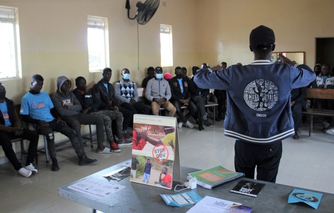 21 year old Reachwell leads a discussion around the role of men and boys in addressing GBV