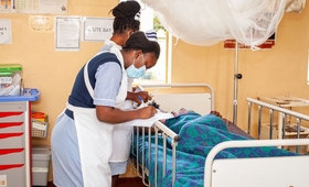 A midwife at Kabwe General Hospital conducting routine monitoring of maternal well-being for an expectant mother