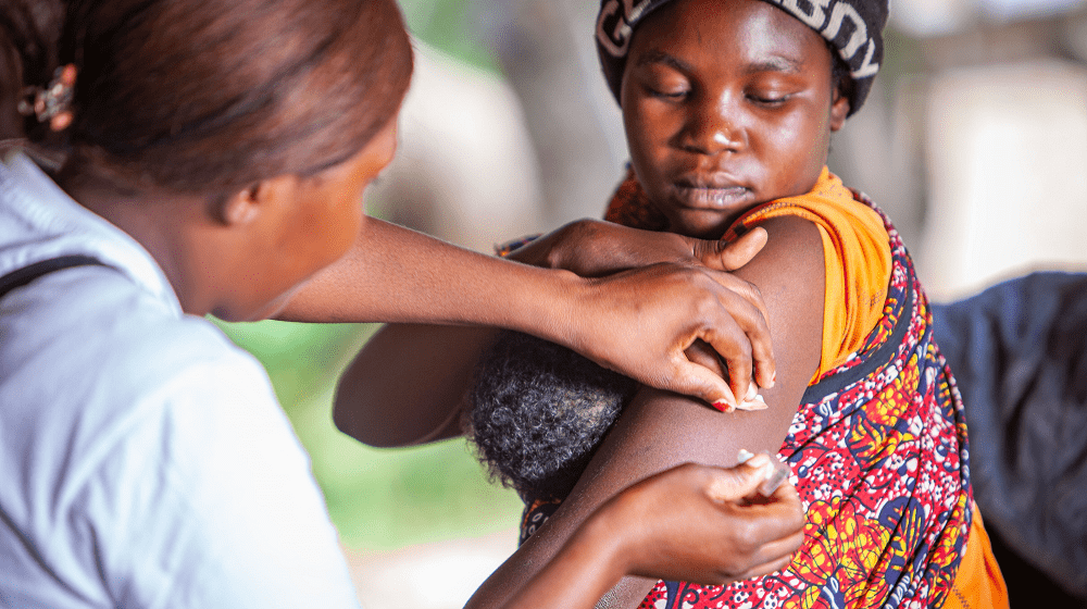 Jacqueline Kalunga, a community-based distributer providing services to a young mother