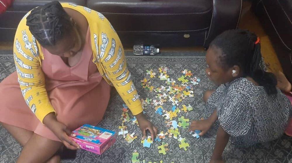 Lina (R) attending a psychosocial counselling session with a counsellor (L) © YWCA