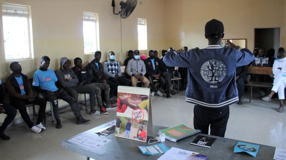 21 year old Reachwell leads a discussion around the role of men and boys in addressing GBV